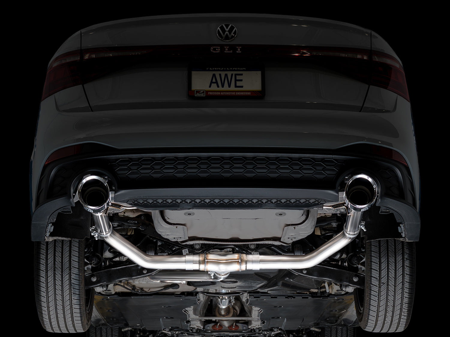 Rear underside of a 2022+ Jetta GLI with the AWE Track Edition installed, studio lighting