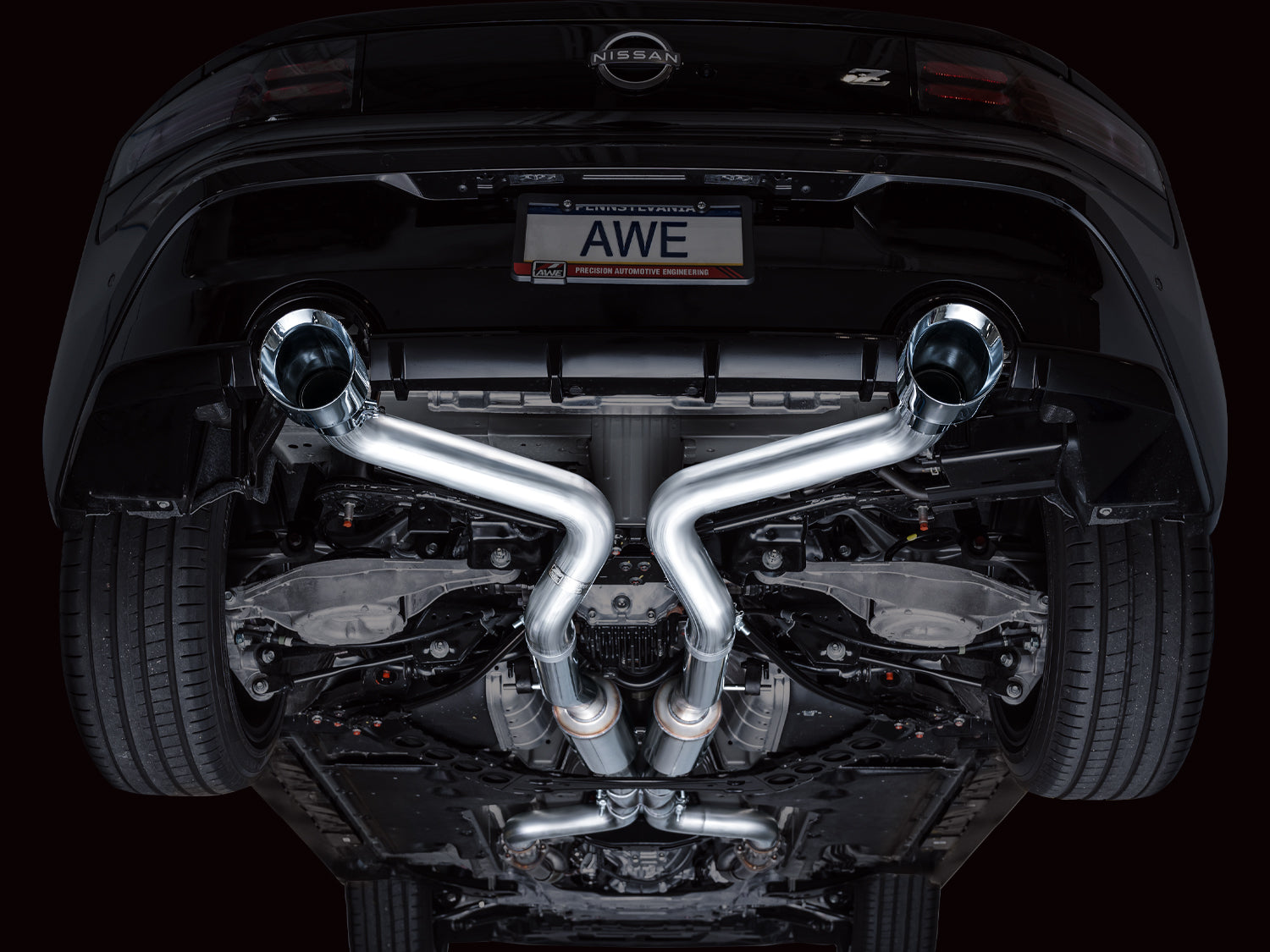 Under a black Nissan Z from behind with the AWE Track X-pipe and straight rear pipes