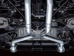Underbody view down the center of a Nissan Z showing the AWE Track X-pipe junction