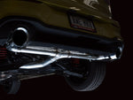 Close-up of a 5-inch Chrome Silver AWE tip under the Mk8 GTI rear bumper