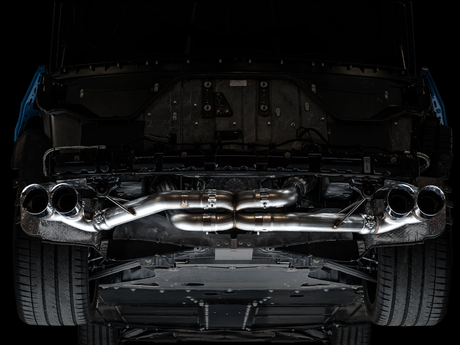 Underside of a C8 Corvette fitted with the AWE Track Edition exhaust and chrome tips