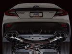 Rear of a white VB WRX on a lift with the AWE Track axle-back and quad Chrome tips