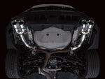 Underside of a white VB WRX with the AWE Track Edition axle-back pipes installed