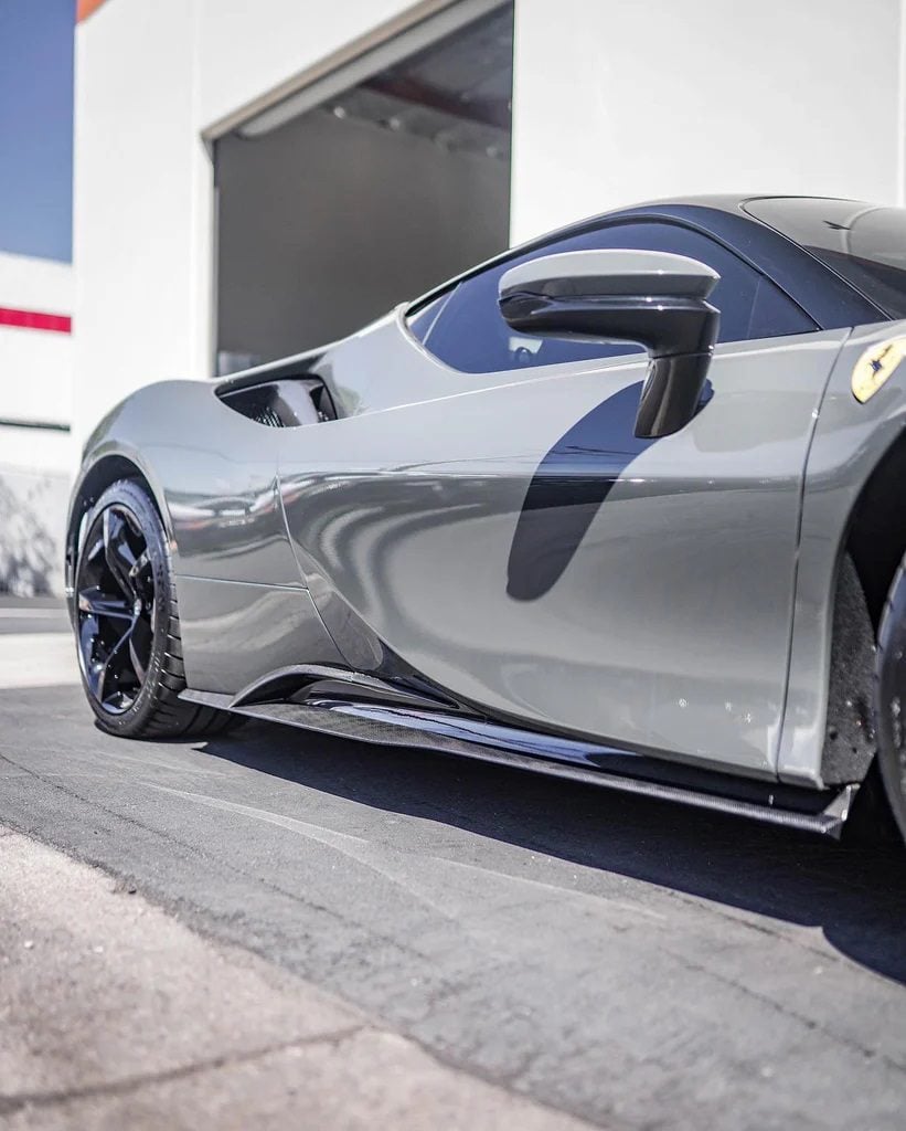 Silver Ferrari SF90 side view showing carbon side skirts