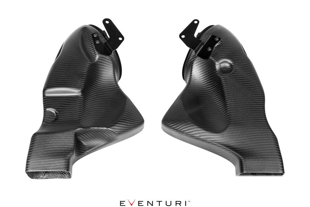 Two carbon fiber intake ducts with curved tubular design and black mounting brackets positioned symmetrically - Eventuri cold air intake for Mercedes-Benz C190 AMG GT S R190 AMG GT C AMG GT R AMG GT
