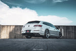 A back wide view of a white car outside on the road fitted with FI Exhaust Catback Exhaust System For Volkswagen Arteon 380 R-Line (OPF) 2021+
