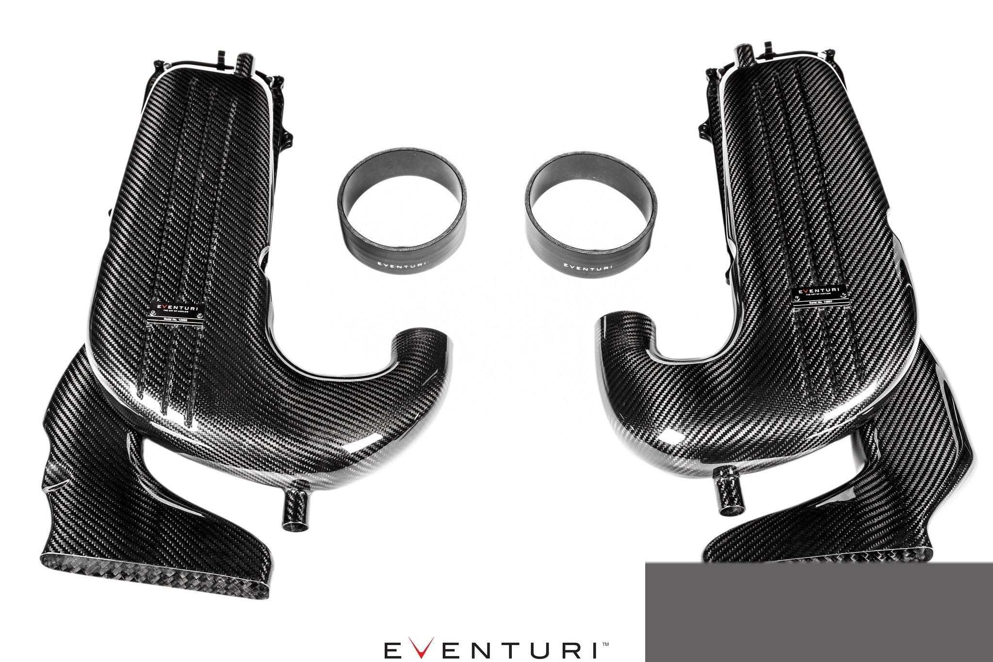 Two carbon fiber intake tubes with curved design and metal connecting rings on white background - Eventuri cold air intake for Mercedes-Benz C253 GLC63 AMG C253 GLC63S AMG