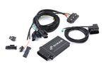 The complete Dinan PCU tuning kit, including the main control module, a high-quality plug-and-play wiring harness with OEM-style connectors, and an OBD-II integration cable for live data monitoring.