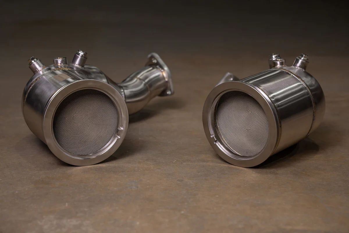 Internal view of Valvetronic Designs 400 cell catted downpipes for Audi C8 RS6 and RS7, showing the high-flow metallic honeycomb substrate.