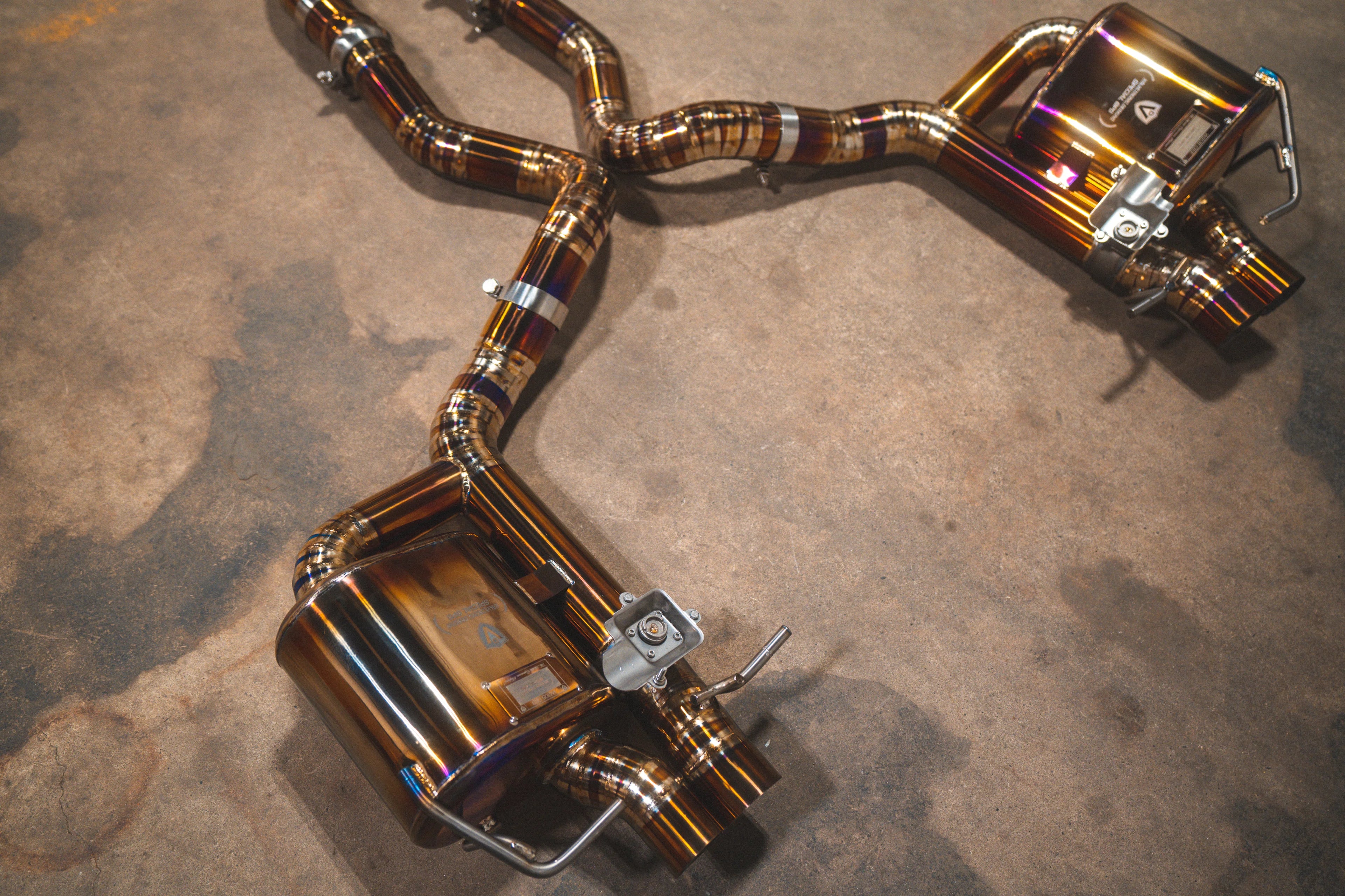 Detailed view of the rear section including the dual mufflers and polished exhaust tips.