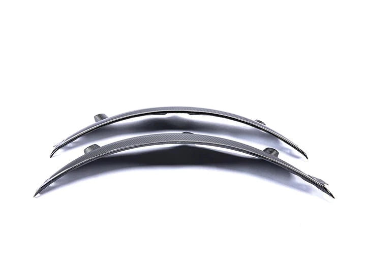 A front view of AUTOTECKNIC CARBON FIBER REAR WHEEL ARCH EXTENSION SET - BMW G80 M3 2021+ with white background