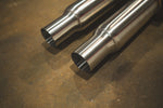 A close-up shot of the dual mid-pipe inlets showing the clean weld beads and the brushed finish of the stainless steel tubing.