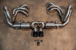 Overhead view of the complete exhaust kit including the valved center muffler, stainless steel headers, and electronic valve control components.