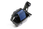 Underside view of the Dinan intake system showing the large, blue high-performance air filter installed within the custom carbon fiber housing to maximize airflow.