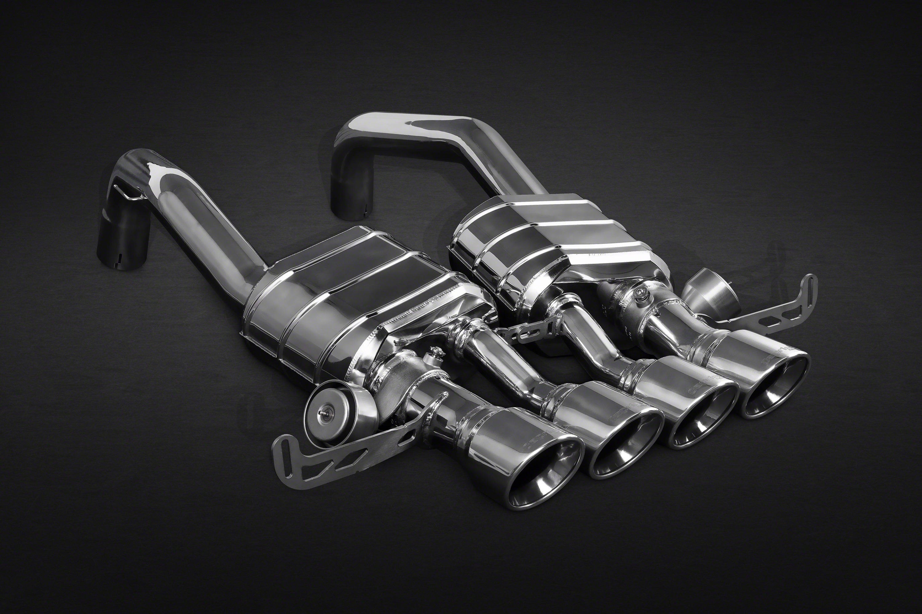 Capristo C7 Corvette valved exhaust with OEM cat adapters, angled view of quad center tips