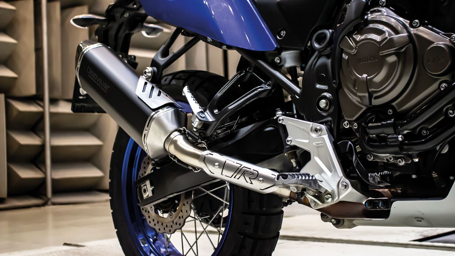 Remus Yamaha Tenere 700 Slip-On Exhaust Black, black silencer installed on an adventure bike, close-up