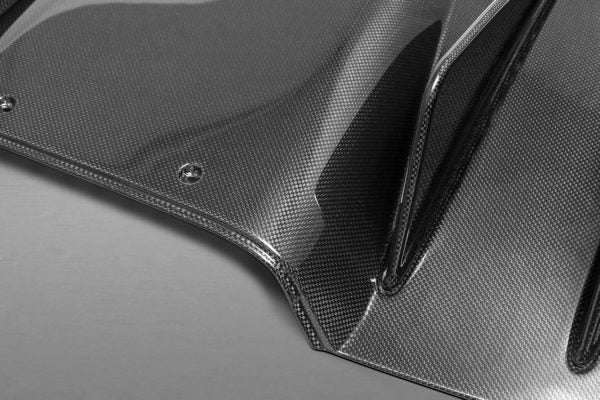 close view of Capristo Carbon Rear Diffuser (Matte) for Ferrari 458 Italia/Spider 2009-2015 with grey background