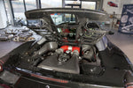 Capristo carbon fiber and glass bonnet on a black Ferrari 458 Spider, raised