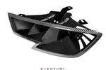 Black carbon fiber headlamp race duct with angular air intake openings and mounting brackets - Eventuri headlamp race duct for Audi RS3