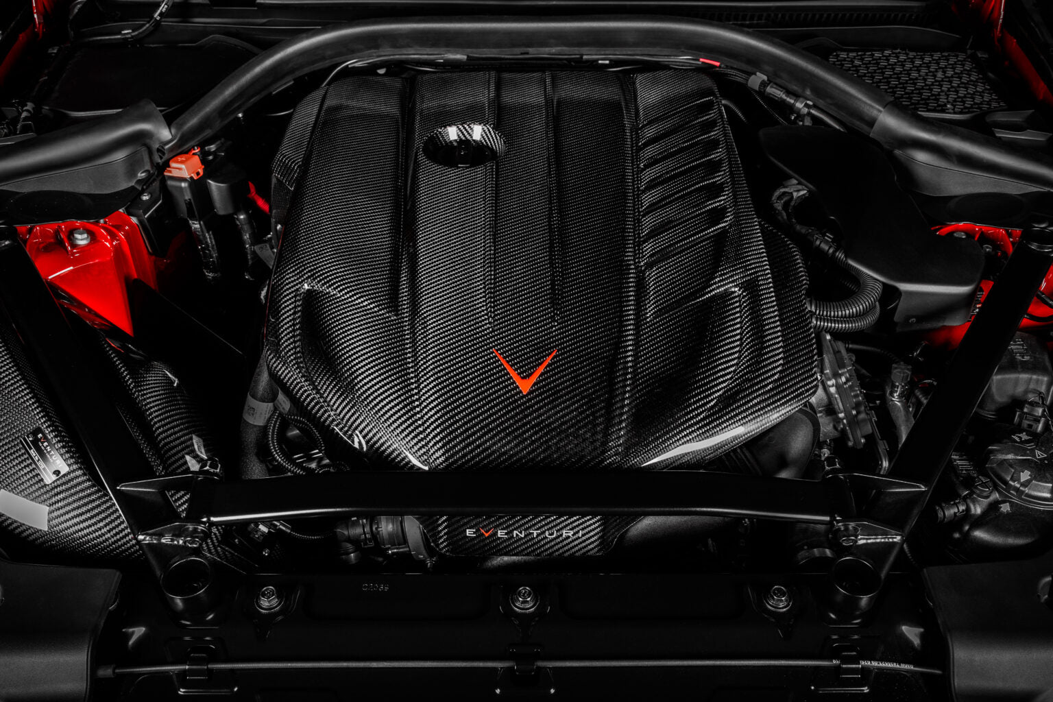 GR Supra 3.0 engine bay from the front with the Eventuri carbon airbox and tube fitted