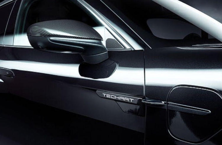 A close up view of TECHART Carbon Fiber Side Mirror Trims Porsche Taycan 2019+