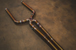 A detailed shot of the X-pipe merge section showing the titanium construction and high-quality weld beads.