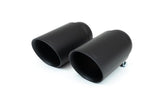 Close-up of a pair of satin black finish exhaust tips with the Fabspeed logo etched on the top edge.