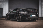 Black Porsche 718 GT4 RS with Capristo exhaust, rear three-quarter