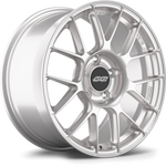 Silver alloy wheel with mesh-style spokes and black center cap, shown at three-quarter angle on white background - APEX Wheels wheel for 18x9 ET46 5x130 - Race Silver