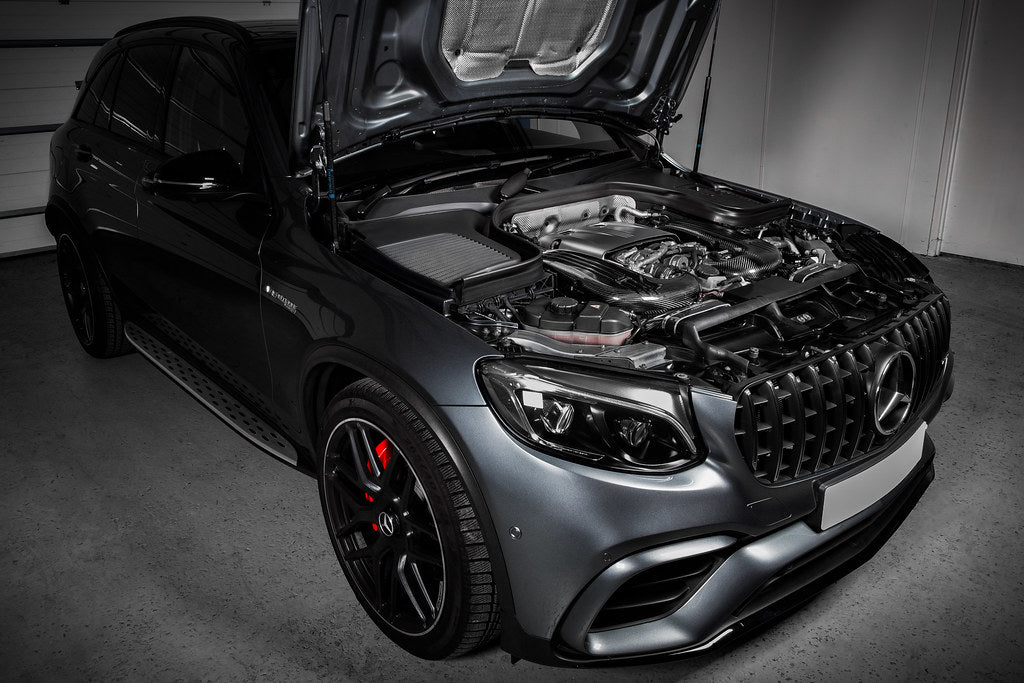 Carbon fiber cold air intake system installed in Mercedes-Benz GLC63 engine bay with hood open - Eventuri cold air intake for Mercedes-Benz C253 GLC63 AMG C253 GLC63S AMG