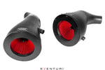 Two black carbon fiber intake tubes with red pleated air filters visible inside circular openings - Eventuri cold air intake for Mercedes-Benz C190 AMG GT S R190 AMG GT C AMG GT R AMG GT