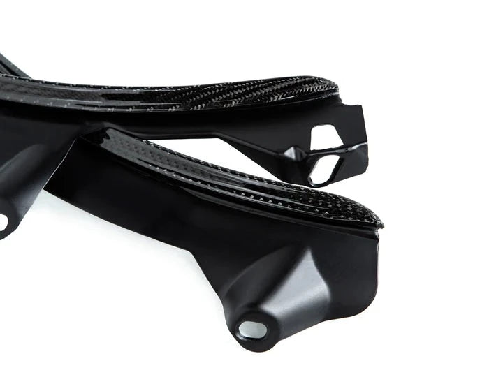 A close up view of AUTOTECKNIC CARBON FIBER REAR WHEEL ARCH EXTENSION SET - BMW G30/ G31 5-SERIES 2017+ with white background