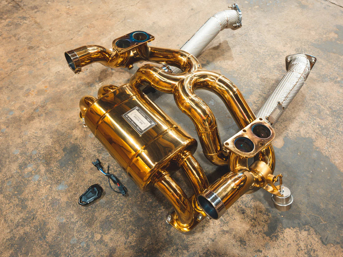 A side overview of Valvetronic Designs Valved Sport exhaust system on the ground (for Ferrari F430 Scuderia / 16M).