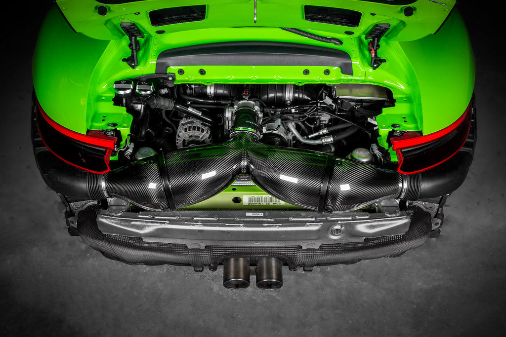 Carbon fiber air intake system installed in bright green GT3RS engine bay with rear deck open - Eventuri air intake system for Porsche GT3RS