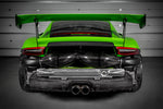 Black carbon fiber intake tubes installed in rear engine bay of green GT3RS with exhaust system visible - Eventuri air intake system for Porsche GT3RS