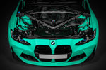 Front of a mint green BMW G8X with the hood up and the Eventuri carbon cover fitted
