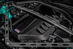 Close angled view of the installed Eventuri carbon cover with M badge below the strut brace