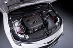 Eventuri carbon intake fitted in a white GR Corolla, seen from the driver side