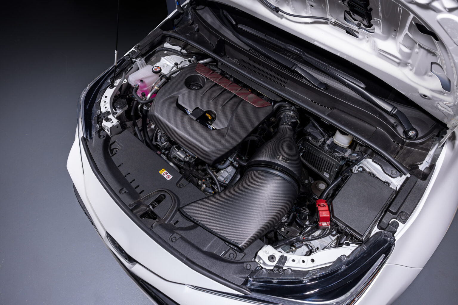 GR Corolla engine bay from the passenger side with the Eventuri duct and housing