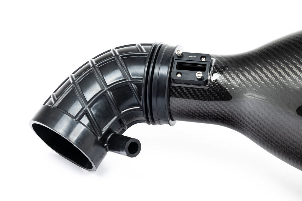 A close up view of Eventuri Black Carbon Intake System Lotus Emira V6 2022+ with white background