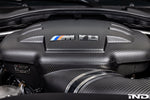Carbon fiber inlet plenum with directional vanes installed in BMW engine bay with M logo - Eventuri inlet plenum for BMW M3