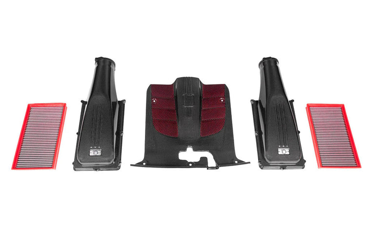 A top wide view of Eventuri Carbon Intake System for Ferrari F12 Berlinetta 2012-2017 with all its parts separately laid out on a white background