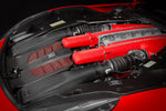 A side close up view of Eventuri Carbon Intake System for Ferrari F12 Berlinetta 2012-2017 fitted inside a red car on a black background