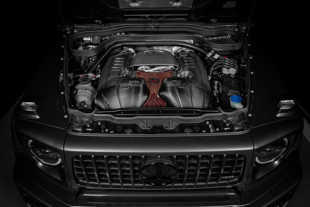 Carbon fiber intake system with red center panel installed in Mercedes engine bay - Eventuri cold air intake for Mercedes-Benz G63 AMG
