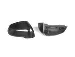 A front and back view of AUTOTECKNIC DRY CARBON FIBER MIRROR COVER SET - BMW U11 X1 2023+ with white background
