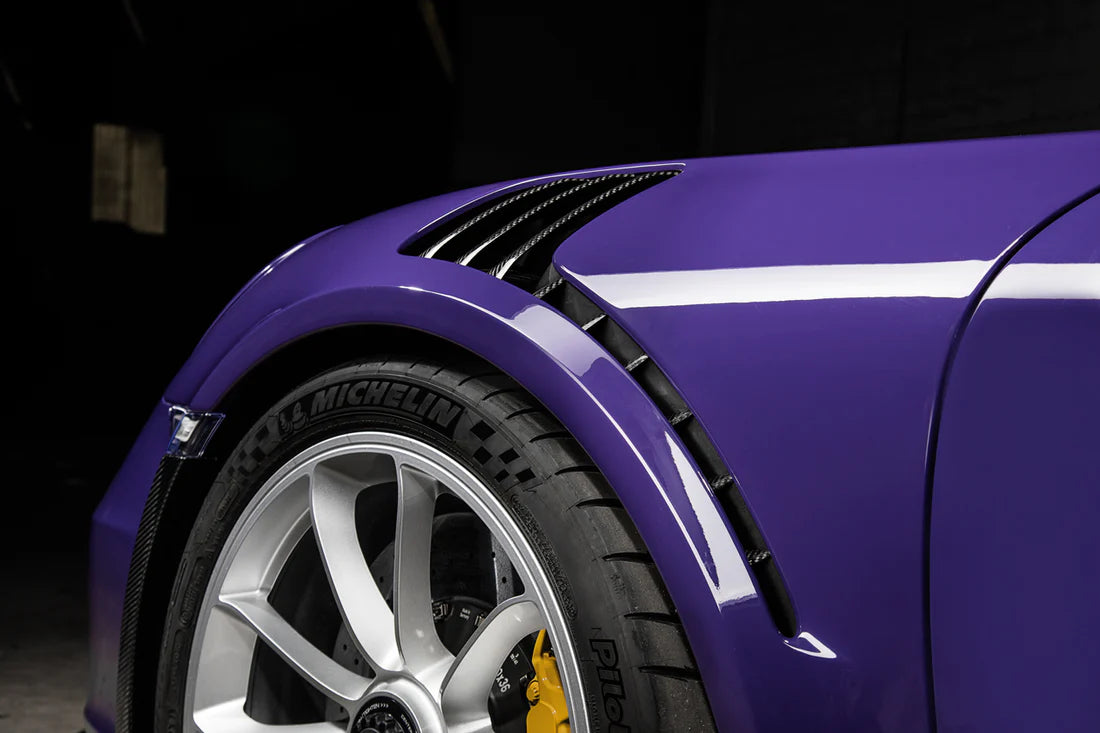 A close up view of TECHART Air Outlet panels in Carbon "glossy" for Porsche 991.1 GT3 RS fitted on a purple Porsche