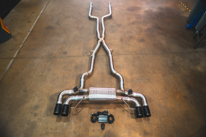 BMW G30 M550i Valvetronic exhaust: full system on the shop floor with black tips
