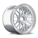 Silver alloy wheel with multi-spoke design and polished lip, angled view showing face and barrel - APEX Wheels wheel for 19x12 ET46 PSCL - Brushed Clear - Machined Lip