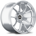 Silver aluminum wheel with ten-spoke design and black center cap, displayed at angle showing face and barrel - APEX Wheels wheel for 19x11 ET9 5x120 - Brushed Clear