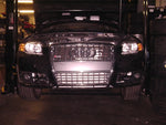 A front view of Evolution Racewerks Audi A4 (B7) Competition Series Front Mount Intercooler (FMIC) Kit installed in a car